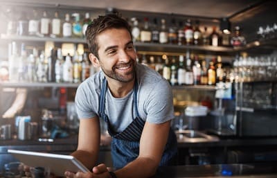 Man taking orders at bar