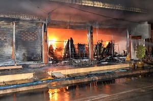 outside of a store that has caught fire